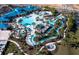 Community pool with lazy river, splash pad, and lounge area at 1671 Kona Ln, Davenport, FL 33897