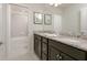 Bathroom with a double vanity, granite countertop, and a shower/tub combo at 1671 Kona Ln, Davenport, FL 33897