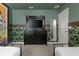 Jungle-themed bedroom with two beds, a TV, and tropical wallpaper at 1671 Kona Ln, Davenport, FL 33897