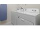Laundry room with a Whirlpool washer and dryer set at 1671 Kona Ln, Davenport, FL 33897