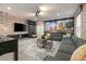 Themed living room featuring Disney artwork, comfortable seating, and a foosball table at 1671 Kona Ln, Davenport, FL 33897