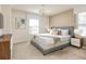 Large bedroom with a king-size bed, dresser, and ample natural light from two large windows at 1671 Kona Ln, Davenport, FL 33897