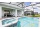 Private screened-in pool and spa with a patio area at 1671 Kona Ln, Davenport, FL 33897