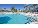 Large community pool with many lounge chairs at 1671 Kona Ln, Davenport, FL 33897
