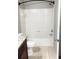 Clean bathroom with white tile, bathtub and granite vanity at 2015 Erving Cir # 108, Ocoee, FL 34761
