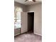 Bright bedroom with window, closet, and neutral walls at 2015 Erving Cir # 108, Ocoee, FL 34761