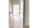 Bright living room with sliding glass doors and hardwood floors at 2015 Erving Cir # 108, Ocoee, FL 34761