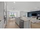 Open concept kitchen with an island and stainless steel appliances at 3022 Norcott Dr, Davenport, FL 33837