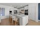 Modern kitchen with white cabinets and a large island at 3022 Norcott Dr, Davenport, FL 33837