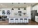 Modern kitchen with white cabinets, island, and stainless steel appliances at 3022 Norcott Dr, Davenport, FL 33837