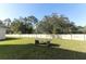 Spacious, fenced backyard with a ping pong table and mature trees at 328 Conway Ave, Saint Cloud, FL 34771