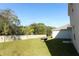 Fenced backyard with a fire pit and lush green grass at 328 Conway Ave, Saint Cloud, FL 34771