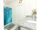Clean bathroom with a shower, double vanity, and granite countertop at 328 Conway Ave, Saint Cloud, FL 34771