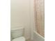 Clean and bright bathroom with a shower/tub combo and whimsical shower curtain at 328 Conway Ave, Saint Cloud, FL 34771