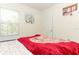Cozy bedroom with a comfortable bed and large window at 328 Conway Ave, Saint Cloud, FL 34771