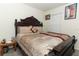 Bedroom features carpet, a dark wood bedframe, and a side table at 328 Conway Ave, Saint Cloud, FL 34771