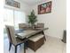Dining area with a table, chairs, and sliding glass doors leading to the backyard at 328 Conway Ave, Saint Cloud, FL 34771