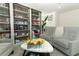 Living room with custom shelving, plush seating, and charming decor at 328 Conway Ave, Saint Cloud, FL 34771