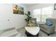 Inviting living room space with two armchairs, a coffee table, and decorative wall art at 328 Conway Ave, Saint Cloud, FL 34771