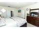 Large Primary bedroom with a comfortable bed and a dresser at 328 Conway Ave, Saint Cloud, FL 34771