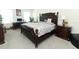 Spacious bedroom with a large bed, nightstands, and a desk at 328 Conway Ave, Saint Cloud, FL 34771