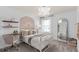 Charming bedroom with a bed, desk, and full-length mirror at 3645 Cambridge Brook Dr, Davenport, FL 33837