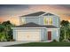 Two-story house with light blue siding, a two-car garage, and a red door at 3645 Cambridge Brook Dr, Davenport, FL 33837