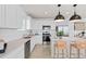 Modern kitchen with white cabinets, stainless steel appliances, and an island at 3645 Cambridge Brook Dr, Davenport, FL 33837