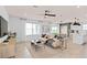 Open living space with beige sofa, large TV, and access to kitchen at 3645 Cambridge Brook Dr, Davenport, FL 33837