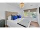 Spacious bedroom with a king-size bed and blue accents at 4756 Ormond Beach Way, Kissimmee, FL 34746