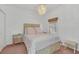 Bright bedroom with a queen-size bed and neutral decor at 4756 Ormond Beach Way, Kissimmee, FL 34746