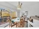 Dining area with white table and access to backyard at 4756 Ormond Beach Way, Kissimmee, FL 34746