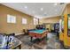 Fun game room with pool table, air hockey, and arcade games at 4756 Ormond Beach Way, Kissimmee, FL 34746
