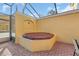 Relax in this covered outdoor hot tub, perfect for unwinding after a long day at 4756 Ormond Beach Way, Kissimmee, FL 34746