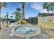 Community hot tub with surrounding landscaping and seating at 4756 Ormond Beach Way, Kissimmee, FL 34746