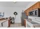 White appliances and wood cabinets in kitchen at 4756 Ormond Beach Way, Kissimmee, FL 34746