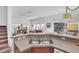 Kitchen island with double sink overlooking living room at 4756 Ormond Beach Way, Kissimmee, FL 34746