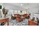 Bright living room with brown couches and a wood coffee table at 4756 Ormond Beach Way, Kissimmee, FL 34746