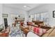 Living room with brown couches and a wood coffee table at 4756 Ormond Beach Way, Kissimmee, FL 34746