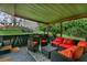 Covered patio with grill, seating area, and fire pit at 507 Orange Ave, Ocoee, FL 34761
