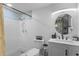 Modern bathroom with a walk-in shower, updated vanity, and contemporary fixtures at 507 Orange Ave, Ocoee, FL 34761