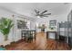 Dining area with a view of the modern kitchen and dark wood floors at 507 Orange Ave, Ocoee, FL 34761