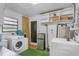 Laundry room with washer, dryer, and storage at 507 Orange Ave, Ocoee, FL 34761