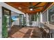 Bright sunroom with wood ceiling, French doors, and a view of the living area at 507 Orange Ave, Ocoee, FL 34761
