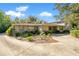 Ranch style home with a large front yard and mature trees at 7200 Grace Rd, Orlando, FL 32819