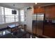 Well-equipped kitchen with stainless steel appliances and wood cabinets at 7503 Mourning Dove Cir # 104, Kissimmee, FL 34747