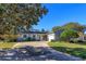 Charming single-story home with a welcoming front porch and landscaped yard at 100 Tedworth Ct, Longwood, FL 32779