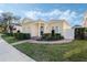 Charming one-story house with a brick walkway and lush landscaping at 1118 White Moss Ln, Celebration, FL 34747