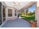 Covered patio with a view of a well-maintained backyard, perfect for outdoor relaxation at 11313 Via Andiamo, Windermere, FL 34786