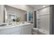 Bright bathroom boasts double sinks, a large shower, and updated fixtures at 1210 Balsam Dr, Davenport, FL 33837